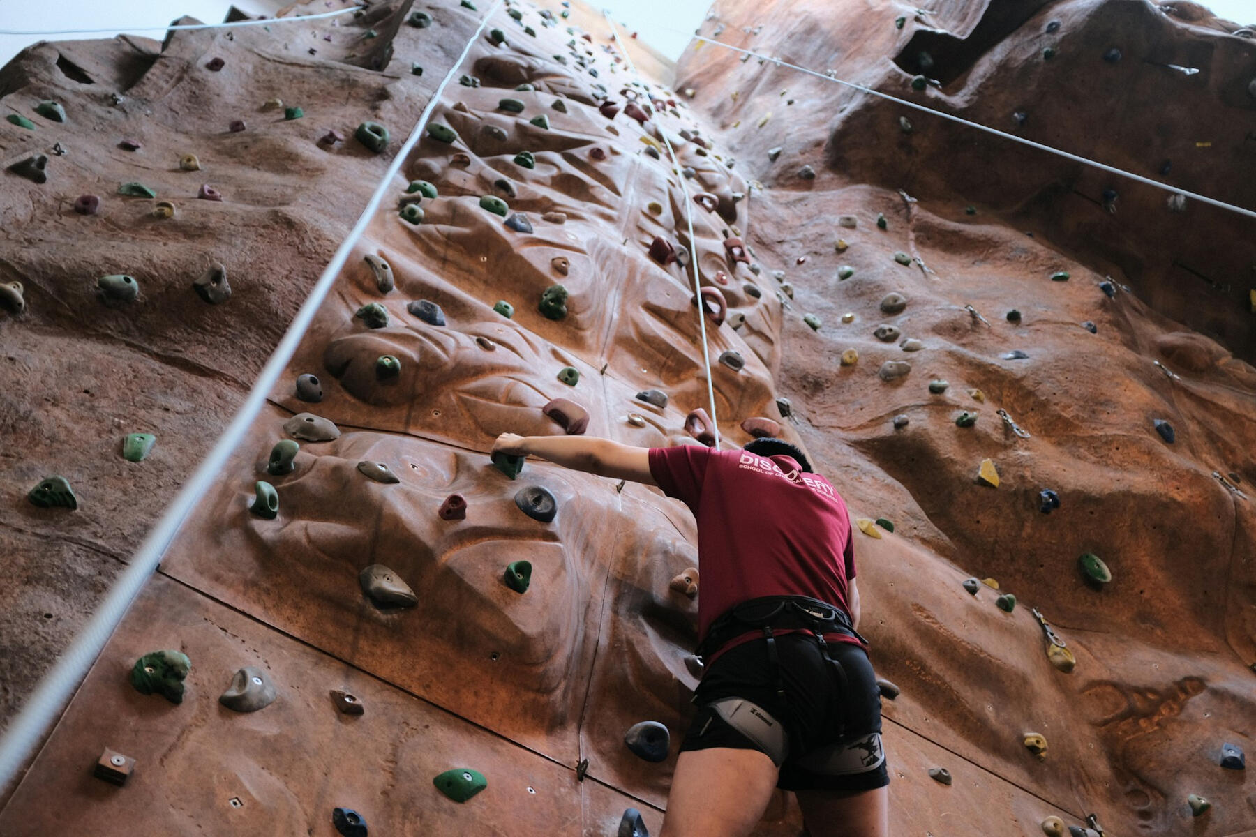 Abseil training on indoor climbing wall